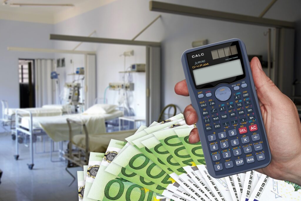 person calculating high medical bill